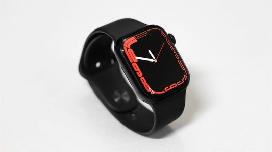Black Apple Watch series 8 38mm on a silicon sport band displayed on the table
