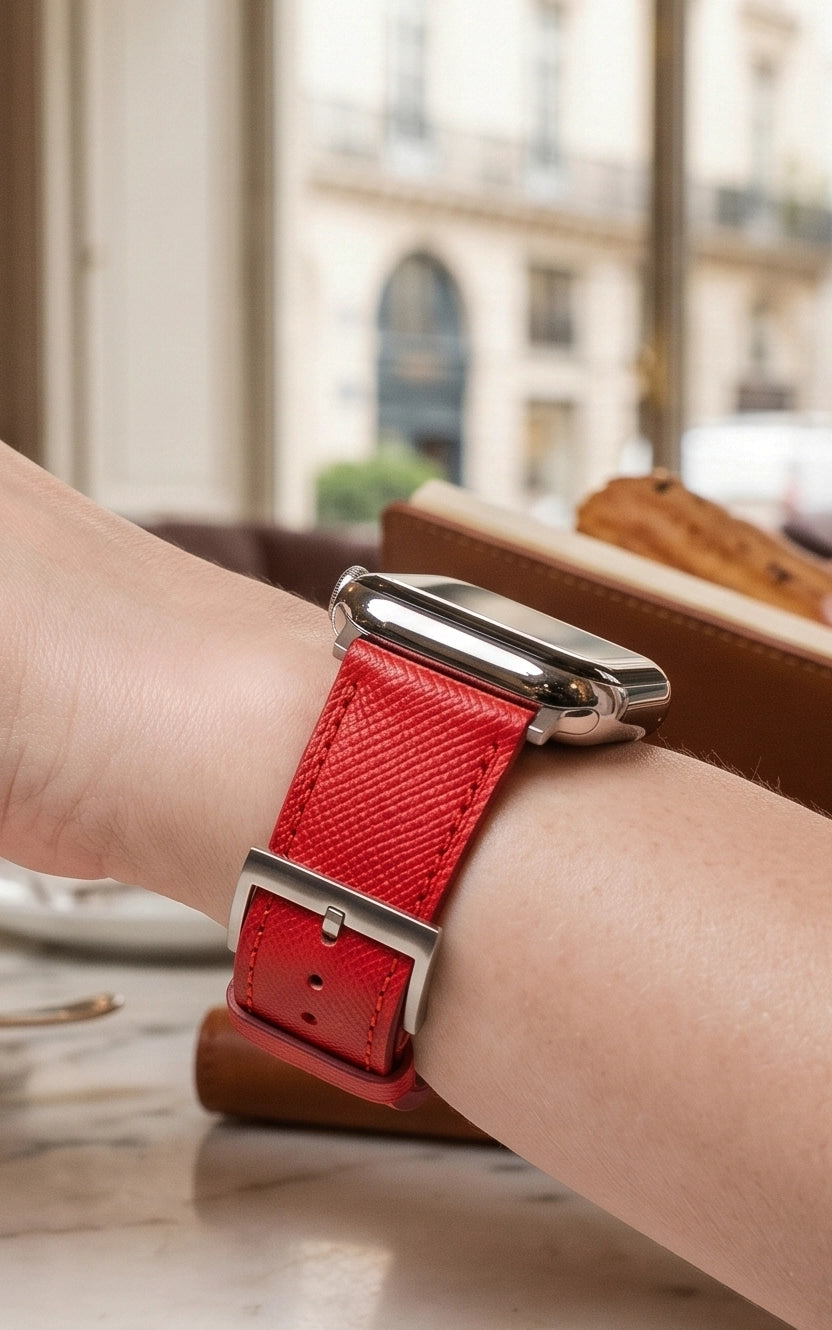 A red colour Saffiano leather pattern handcrafted for Apple watch series 11 42mm 45mm and 46mm worn on the wrist by a women side angle