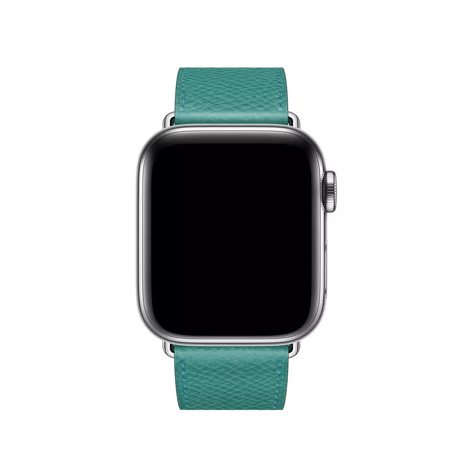 A turquoise colour genuine leather single tour watch strap on the latest apple watch