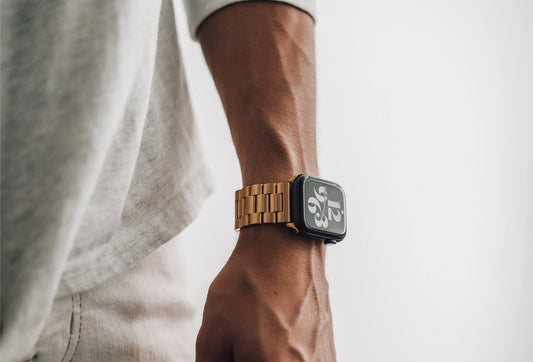 Men's metal silver apple watch band on a mans arm