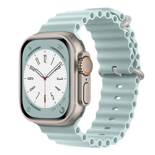 A pale blue colour silicon watch strap with two metal buckles on an apple watch series 9 and ultra designed for the ocean