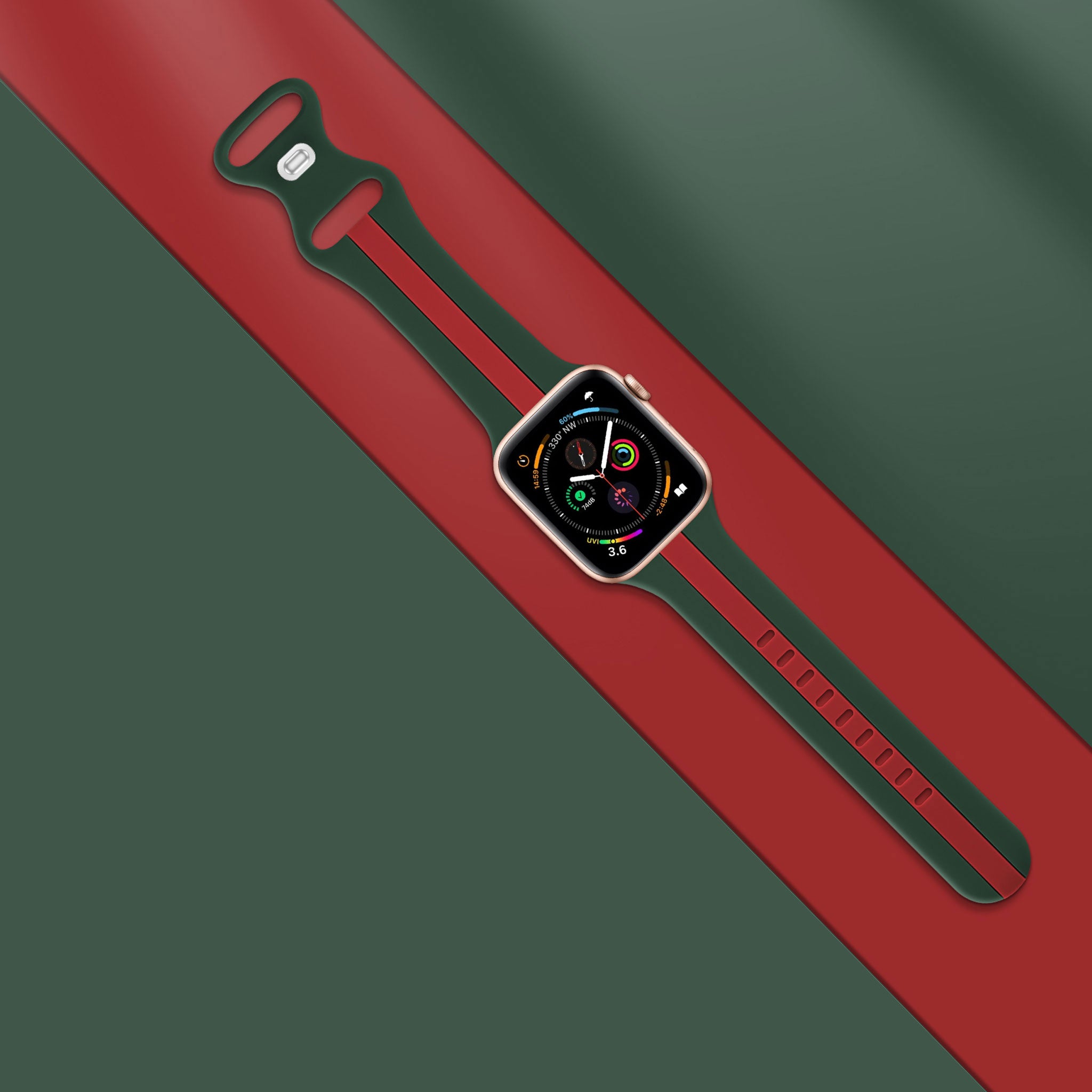 A green and red colour silicon watch band on an apple watch series 8 rose gold