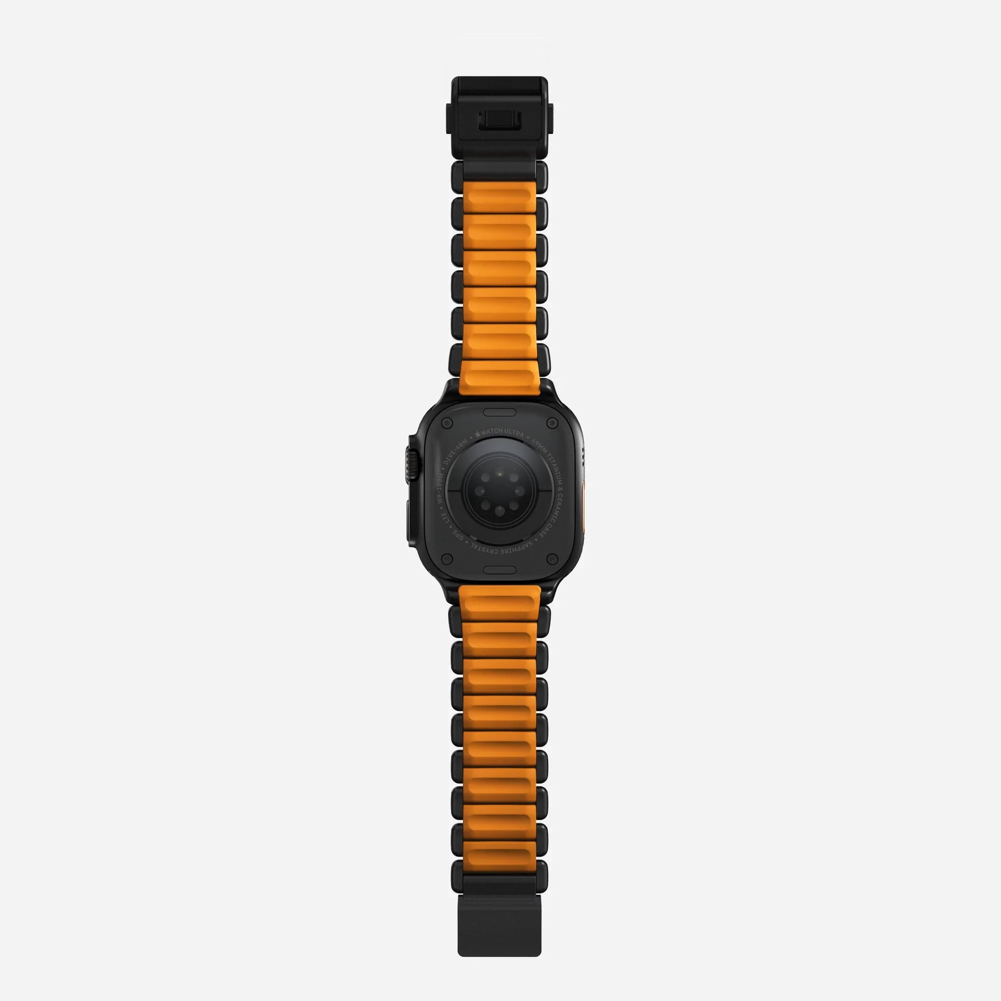 A orange colour brushed titanium metal with silicone rubber hybrid strap on an Apple watch series 11 and ultra 3 42mm 45mm 46mm 49mm built with magnetic clasps