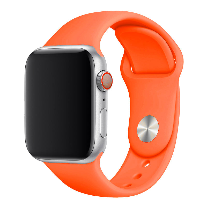 A neon orange colour watch band on an apple watch made from silicon material
