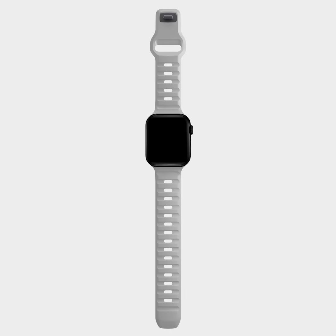 A grey colour silicon watch strap for apple watch ultra designed for active sports and heavy duty activities